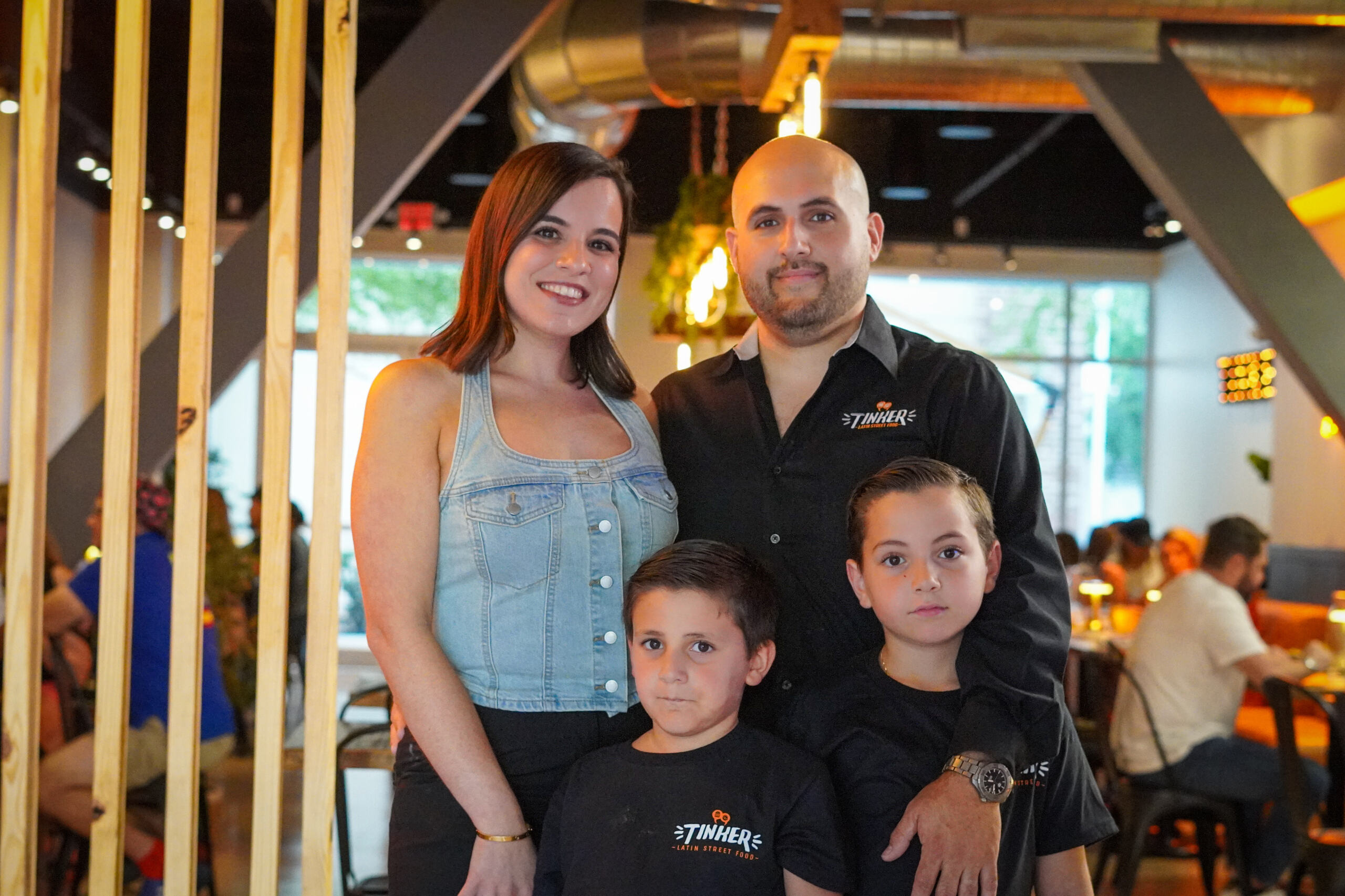 Owners Tinker and Antonella with their two sons inside the Tioga Restaurant.